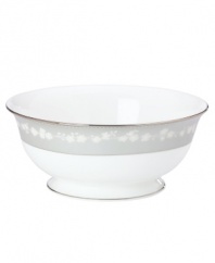 To entertain with grace and style look no further than this Bellina serving bowl from Lenox's dinnerware and dishes collection. Elegant bone china with a delicate floral design and textured white beads is finished with platinum trim. Serving bowl shown back. Qualifies for Rebate