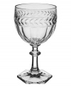 Regal shaping blends with romantic accents in this storybook stemware pattern from Villeroy & Boch. Ornate cut crystal stems support fluted bowls crowned by a fern leaf band.