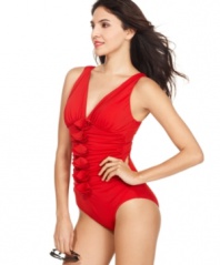 INC International Concepts' swimsuit offers tummy control draped in ruching and elegant ruffles. Wear with oversized sunglasses for a vintage-inspired, glamorous look!