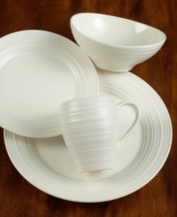 Evoking the natural exuberance of thrown pottery, the Mikasa Swirl salad plate brings unfussy elegance to your table in classic stoneware.  Salad plate shown left.