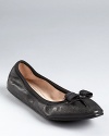 Tiny pleats and grosgrain trim give these bow-topped leather flats an extra hint of girlish charm. From Salvatore Ferragamo.