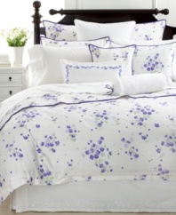 Graceful garden style abounds in Martha Stewart Collection's Trousseau Violets quilted sham, featuring purple blooms and trim in a bed of white cotton.
