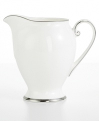 Bright fine china is simply adorned with a band of platinum for an unforgettably elegant table. The Cameo Platinum design from Mikasa's dinnerware and dishes collection is perfect for formal dinners, teas, and luncheons. This creamer's delicate, flowing lines add a graceful touch to your table.