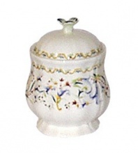 A stitch in time… this sensational accessory tells a detailed story. Covered sugar bowl encompasses a continuos scroll of delicate, warm colors. Perfect of hold cubes or powdered sugar.