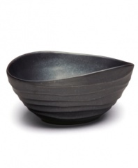 Down-to-earth dining. This Earth serving bowl has a handcrafted feel with a fluid shape and steely sheen to complement the Nambe dinnerware collection.