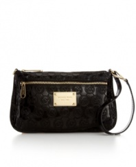 This gorgeous signature wristlet by MICHAEL Michael Kors offers a subtle sophistication with just enough polish to turn heads. A monogram exterior features high-shine hardware and a signature plaque at front.