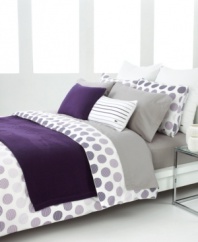 Spot on. Lined dots in shades of purple give this Lacoste comforter set a decidedly mod appeal. Self-reversing; finished with a solid piped edge.