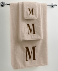 Dry off in your signature style with monogrammed towels from Avanti. Embroidered with a single capital letter in Bodoni font, this combed cotton hand towel makes it easy to personalize your bath.