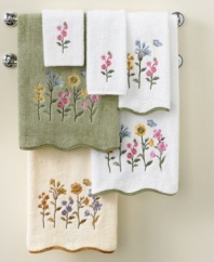 Escape into a garden of plush delights with Avanti's Premier Country Floral bath towel, featuring beautiful embroidery and a scalloped fabric trim on pure Egyptian cotton.