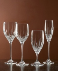 Set a table with enduring appeal. This classically elegant wine glass features intricately cut facets and graceful lines. Wine glass shown second from left.