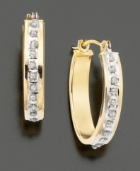 The traditional hoop earrings embellished with the sparkle of a diamond accent. Set in 14k gold.