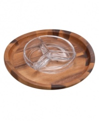 With elegant swooping edges crafted in luxurious acacia wood, this condiment server from Nambe's collection of serveware and serving dishes mimics the grace and beauty of a butterfly in flight. A smart sectioned bowl, sculpted in gleaming crystal, maintains an elegant visual, whatever you're serving.