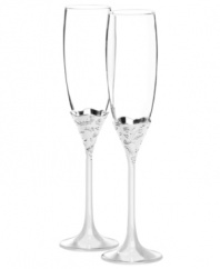 Pop the champagne. Featuring silver-plated stems with raised floral accents, Vera Lace Bouquet toasting flutes from Vera Wang Wedgwood will grace the newlyweds' reception and, later, their home.