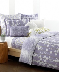 The Sakura comforter set from Style&co. presents a chic floral cut-out over soft purple with detailed green line embroidery. Digital purple droplets on the reverse create effortless charm, fit for the modern bedroom.