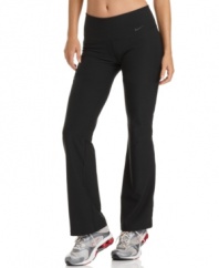 Nike's Legend bootcut athletic pants feature a wide waistband and a contoured fit to give you plenty of coverage any way you bend or stretch!