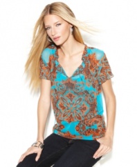 The cool combination of sheer fabric and a bold-hued print makes for a hot look, from INC.