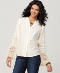 Channel the enduring style of an era gone by with this lace cuff, bell sleeve blouse by Lucky Brand Jeans. A few simple accessories are all you need to complement this beautiful silk-blend top.