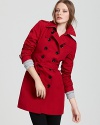 Vibrant military red adds festive flair to the season's brisk days, rendered in an iconic silhouette from Burberry Brit.