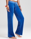 These plush velour Juicy Couture pants lend glam to your weekend with a back Juicy graphic.