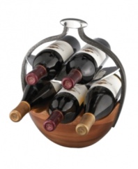 Stash extra wine bottles in the Anvil sculpture-turned-storage basket from Nambe. The wine rack features a mix of handsome acacia wood and signature Nambe metal contrasted by a rustic, iron-finished arch. Designed by Neil Cohen.