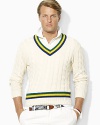 Accented with preppy stripes for an athletic-inspired finish, a classic cricket sweater is cable-knit from plush Pima cotton yarns for an ultra-soft hand.