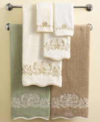 Soft and feminine, the Venetian Scroll hand towel marries a delicate look with durable Egyptian cotton. Swirling blooms embroidered in creamy shades echo a bound, scalloped edge. In muted sage, ivory and linen for serene elegance.