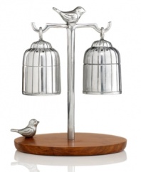 Martha Stewart Collection combines sheesham wood and polished metal in this utterly charming Park Birds salt and pepper set, featuring two feathered friends watching over their cages.
