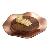 Warm wood and fiery metal combine to create a breathtaking piece that instantly puts the spotlight on your brie or camembert. A richly variegated wooden platform balances over a copper-plated, lilypad-esque base.