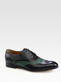 Leather lace-up with brogueings.Leather soleMade in Italy