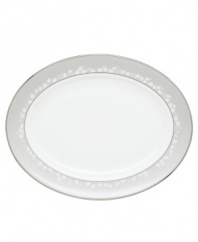 To entertain with grace and style look no further than this Bellina oval platter from Lenox's dinnerware and dishes collection. Elegant bone china with a delicate floral design and textured white beads is finished with platinum trim. Platter shown back. Qualifies for Rebate