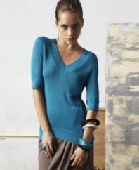 With a slouchy shape and asymmetrical hem, this doo.ri for Impulse tunic sweater is perfect for everyday effortless-chic!