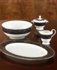 Make an unabashedly dramatic statement at your table with the soup bowl (not shown) from the Mikasa Elegant Scroll Dinnerware Collection, which plays a lively vine pattern against a deep ebony background.