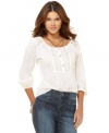 Rendered from lightweight cotton and featuring a vintage-inspired design, this DKNY jeans top is a romantic classic!