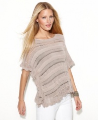 Built to turn heads, INC's intricately-knit poncho features a touch of metallic shine!