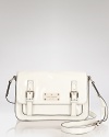 kate spade new york gives the classic crossbody satchel a hit of gloss. Boasting an classic, scholarly shape, this bag is school-girl chic with a pleated skirts and glasses.