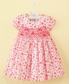 Prettiest pick of the bunch. You'll want to show off your precious flower in this floral dress from First Impressions.