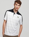 Get the court-ready look in a lightweight short sleeve striped polo with a thick contrasting stripe across the shoulders.