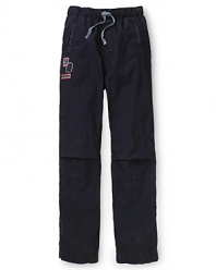 Sporty track pants by GUESS Kids get a stylish accent with logo details and a drawstring waist.