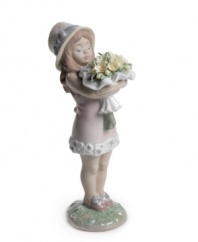 This very precious young lady clutches a spring bouquet of yellow daisies. A charming and nostalgic moment, captured in blushing pastel-colored porcelain. 7 x 2.