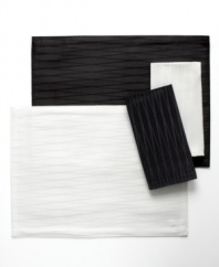 Made for celebration, the Cheers Twist napkin by Mikasa sets the scene with an understated linear pattern and dressy sheen in versatile black or white. Machine washable table linens make for an especially happy host, too.