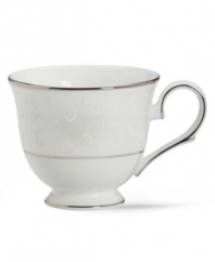 Pure opulence. Posh opalescence. This classically designed line of Lenox dinnerware and dishes is accented by a platinum rim and a delicate flourish of vine-like, white-on-white imprints with raised, iridescent enamel dots. Great gift for housewarming, wedding or yourself. Teacup shown left. Qualifies for Rebate