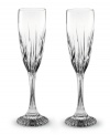 The resplendent crystal and quintessential French design of Baccarat's Jupiter champagne flutes set a new standard for fine dining. Vertical cuts extend from bowl to base in these two toasting flutes, making for stemware that exudes vintage grandeur.
