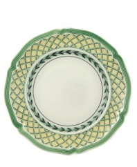 Bring the lush bounty of the French countryside to your table with this vibrant mix-and-match dinnerware and dishes collection from Villeroy & Boch. This scalloped bread and butter plate is available in four complementary patterns. The Fleurence pattern has a pale yellow center encircled with a garland of summer fruits. The Valence pattern has a yellow rim that surrounds a painted bunch of cherries in the center. The Orange pattern features a green and yellow trellis on the rim while the Vienne pattern is white with a yellow rim that's framed by green edging and the recurring leaf garland.