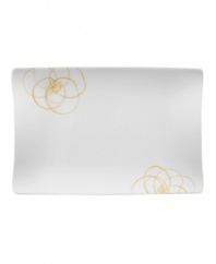 A modern canvas for everyday meals, the large Bloom Sun rectangular plates have a smooth, flat surface that's artfully scribbled with golden florals for a look that's fresh--and in durable porcelain--not fussy. From Villeroy & Boch.
