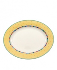 Spice up your main disheds with the Twist Alea oval platter. The bright enamel colorblock design is a perfect contrast to the fine white china. Features a vivid band of color along the rim.