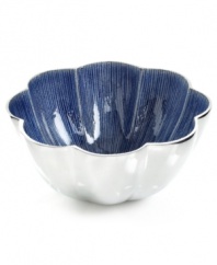 More than conversation blossoms around your table with a handcrafted Parisian Blue Lotus bowl from Simply Designz. Polished aluminum lined in glossy enamel lends fresh color and shine to any dining area.