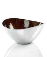 Full of surprises, this handcrafted salad bowl from the Simply Designz collection of serveware and serving dishes features sleek, polished aluminum lined with rich, earthy amber. Keep it on display no matter what's on your menu.