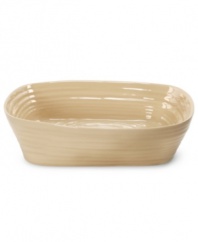 From celebrated chef and writer, Sophie Conran, comes incredibly durable dinnerware for every step of the meal, from oven to table. A ribbed texture gives this rectangular roaster/lasagna dish the charming look of traditional hand thrown pottery. Shown in white.