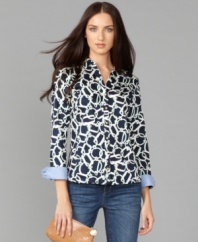 Go geometric in this striking shirt from Tommy Hilfiger. Goldtone buttons and solid foldover cuffs lend the right preppy touch to this versatile top. (Clearance)