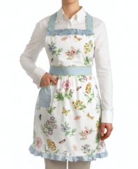 Home chefs stay fresh in the kitchen with the Butterfly Meadow apron by Lenox. Sweet blooms and butterflies, ruffled blue accents and leafy green trim evoke the cheery essence of spring in pure cotton.